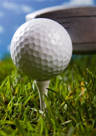 range shooting - Golf ball on tee in grass. Foto de stock - Super Valor sin royalties y Suscripción, Código: 400-04076654