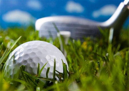 range shooting - Golf ball on tee in grass. Foto de stock - Super Valor sin royalties y Suscripción, Código: 400-04076660