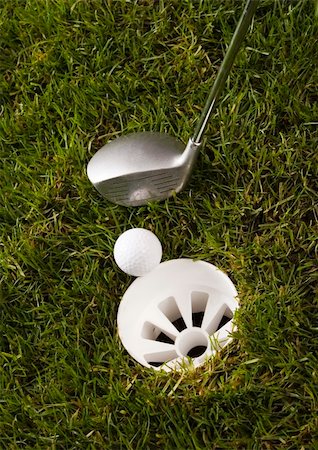 range shooting - Golf ball on tee in grass. Foto de stock - Super Valor sin royalties y Suscripción, Código: 400-04076670