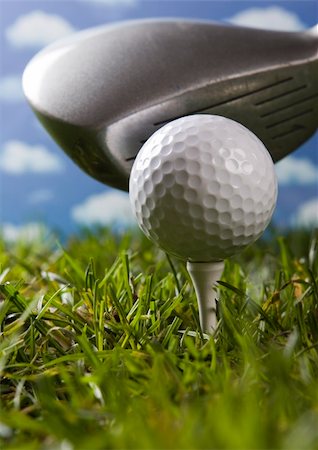 simsearch:400-03975619,k - Golf ball on tee in grass. Stock Photo - Budget Royalty-Free & Subscription, Code: 400-04076672