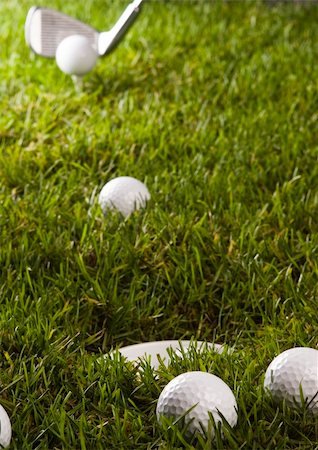 range shooting - Golf ball on tee in grass. Foto de stock - Super Valor sin royalties y Suscripción, Código: 400-04076695