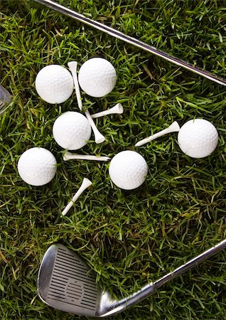 simsearch:400-03975619,k - Golf ball on tee in grass. Stock Photo - Budget Royalty-Free & Subscription, Code: 400-04076697