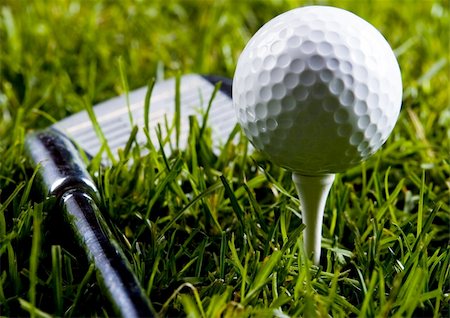 simsearch:400-03975619,k - Golf ball on tee in grass. Stock Photo - Budget Royalty-Free & Subscription, Code: 400-04076691