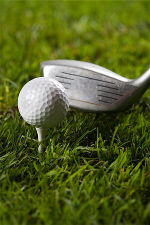 simsearch:400-03975619,k - Golf ball on tee in grass. Stock Photo - Budget Royalty-Free & Subscription, Code: 400-04076747