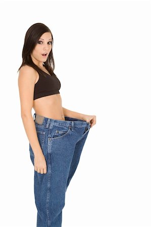 Caucasian woman hold old jeans to show weight loss Stock Photo - Budget Royalty-Free & Subscription, Code: 400-04079250