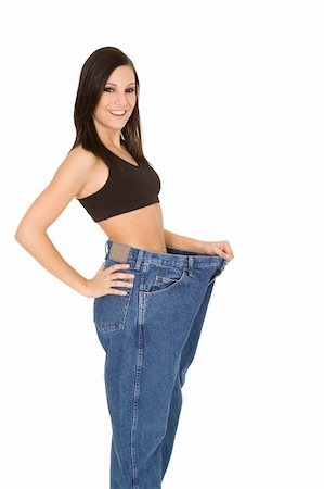 Caucasian woman hold old jeans to show weight loss Stock Photo - Budget Royalty-Free & Subscription, Code: 400-04079251