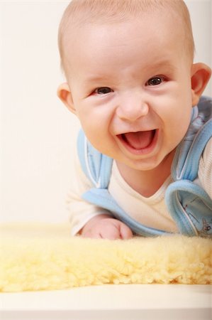 simsearch:400-04161658,k - Portrait of cute newborn laughing Fotografie stock - Microstock e Abbonamento, Codice: 400-04079969