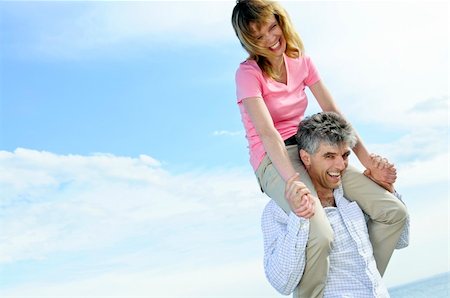 shoulder ride older men - Mature romantic couple of baby boomers enjoying outdoors Stock Photo - Budget Royalty-Free & Subscription, Code: 400-04070046