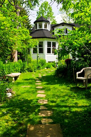 simsearch:400-06892146,k - Path of steeping stones leading to a house in lush green garden Stock Photo - Budget Royalty-Free & Subscription, Code: 400-04070064