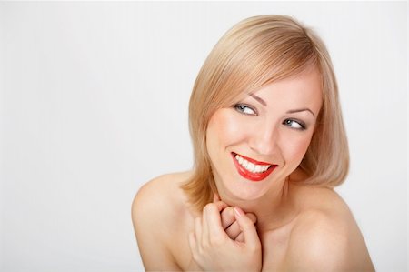 simsearch:400-04520503,k - teeth; beautiful; female; person; blond; happiness; portrait; vitality; cheerful; adult; people; lips; perfection; flirting; expression; model; make-up; playful; joy; girl Stock Photo - Budget Royalty-Free & Subscription, Code: 400-04070269