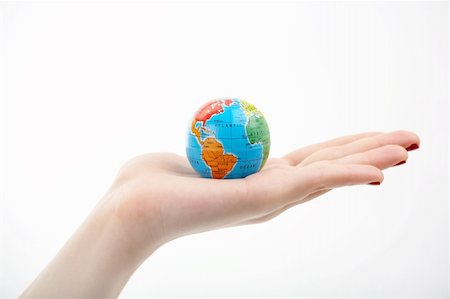 simsearch:400-04633938,k - The globe in a hand on a white background Stock Photo - Budget Royalty-Free & Subscription, Code: 400-04070271