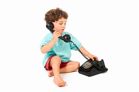 young boy talking on a retro phone isolated on white Stock Photo - Budget Royalty-Free & Subscription, Code: 400-04070490
