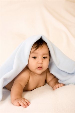 simsearch:400-04530129,k - cute kid lying down on his tummy on blanket playing peek-a-boo Stock Photo - Budget Royalty-Free & Subscription, Code: 400-04070758