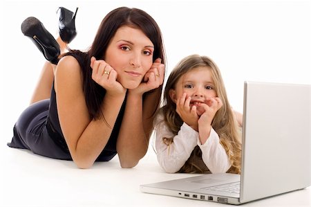 simsearch:400-04712944,k - Young mother teaching her daughter how to use laptop and internet Stock Photo - Budget Royalty-Free & Subscription, Code: 400-04071535