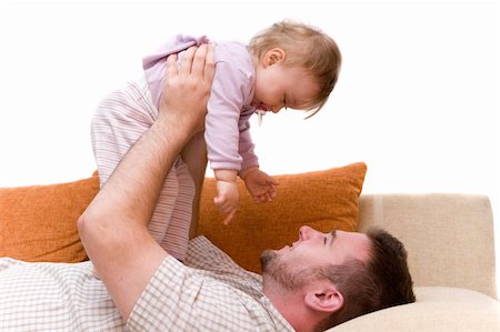 father and baby girl playing on sofa Photographie de stock - Aubaine LD & Abonnement, Code: 400-04071608