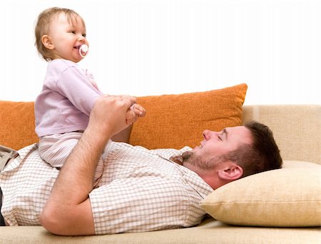 father and baby girl playing on sofa Photographie de stock - Aubaine LD & Abonnement, Code: 400-04071629