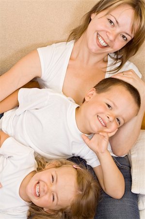Happy family relaxing on the sofa Stock Photo - Budget Royalty-Free & Subscription, Code: 400-04071641