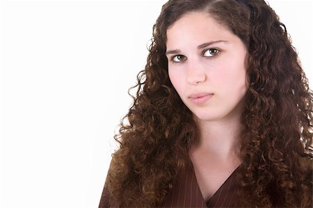 simsearch:400-04204790,k - Beautiful young girl with brown curly hair. Isolated on white background. Photographie de stock - Aubaine LD & Abonnement, Code: 400-04071652