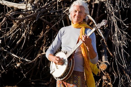 simsearch:400-05080507,k - Banjo Player in Front of a Big Pile of Wood Stock Photo - Budget Royalty-Free & Subscription, Code: 400-04072374