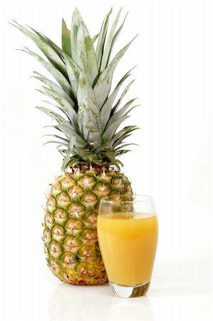 simsearch:400-09220883,k - Pineapple with juice on bright background Stock Photo - Budget Royalty-Free & Subscription, Code: 400-04072528