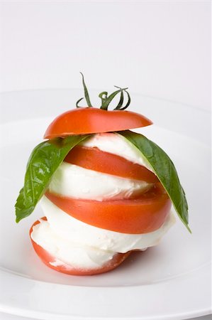 salad greens on white background - caprese: tomatoe, basil and mozarella cheese Stock Photo - Budget Royalty-Free & Subscription, Code: 400-04072545