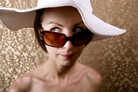 peeping fashion - Young Woman with Sunglasses and a Floppy White Hat Stock Photo - Budget Royalty-Free & Subscription, Code: 400-04072692