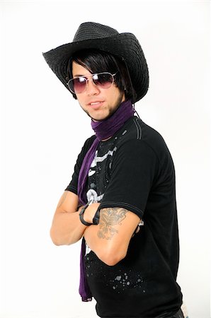 Portrait of young trendy guy with cowboy hat - isolated Foto de stock - Super Valor sin royalties y Suscripción, Código: 400-04072790