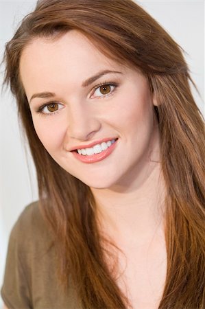 simsearch:400-03920671,k - Studio shot of a beautiful young brunette woman with striking brown eyes and a lovely smile. Stock Photo - Budget Royalty-Free & Subscription, Code: 400-04072987