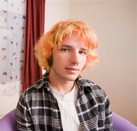 simsearch:400-06330521,k - Closeup of a Young man with Bright Hair in a Bare Room Photographie de stock - Aubaine LD & Abonnement, Code: 400-04073012