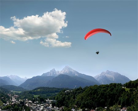 skydiving silhouette - Very beautiful landscape in the german Alps with the mountains Watzmann and Hochkalter, a Para glider and the village of Berchtesgaden Stock Photo - Budget Royalty-Free & Subscription, Code: 400-04073137