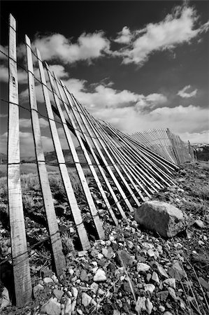 sascha (artist) - old rural fence running through mountain countryside in Wyoming Fotografie stock - Microstock e Abbonamento, Codice: 400-04073565