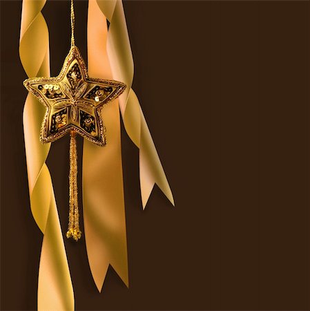 simsearch:400-04073863,k - Gold christmas star with ribbons against dark background Photographie de stock - Aubaine LD & Abonnement, Code: 400-04073869