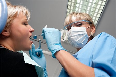 dental drill - doctor works with patient in the dentist office Stock Photo - Budget Royalty-Free & Subscription, Code: 400-04084720