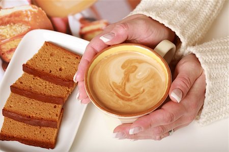 simsearch:400-05079087,k - Woman hands with cup of milf coffee with biscuit Stock Photo - Budget Royalty-Free & Subscription, Code: 400-04084862