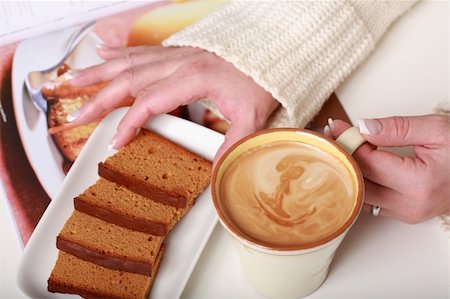 simsearch:400-05079087,k - Woman hands with cup of milf coffee with biscuit Stock Photo - Budget Royalty-Free & Subscription, Code: 400-04084863