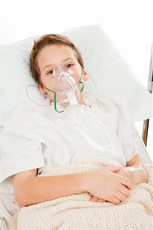 patient on bed and iv - Sick little boy in the hospital breathing with an oxygen mask. Stock Photo - Budget Royalty-Free & Subscription, Code: 400-04085056