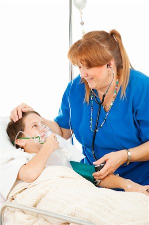 patient on bed and iv - Friendly pediatric nurse comforts a small boy in the hospital. Stock Photo - Budget Royalty-Free & Subscription, Code: 400-04085058