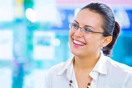 Portrait of young beautiful smiling  girl in office environment Stock Photo - Budget Royalty-Free & Subscription, Code: 400-04089025