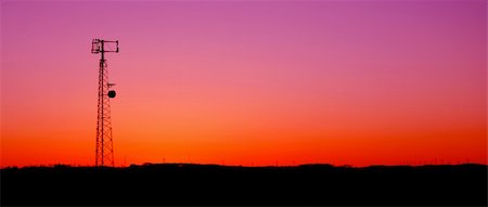 simsearch:700-03014826,k - A cell phone tower silhouette in the sunset. Photographie de stock - Aubaine LD & Abonnement, Code: 400-04080142