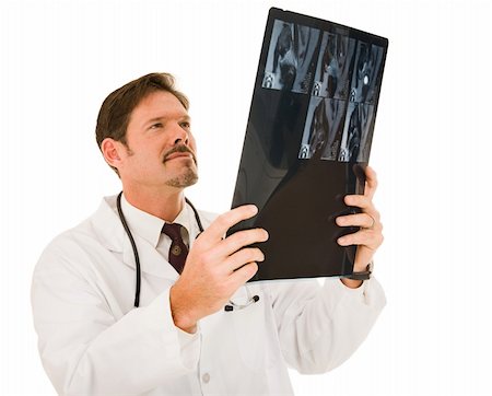 simsearch:400-05088212,k - Handsome doctor examining a patient's MRI results.  Isolated on white. Stock Photo - Budget Royalty-Free & Subscription, Code: 400-04080331