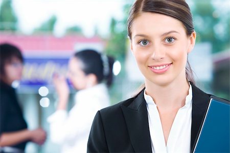 Portrait of young pretty woman in business environment Stock Photo - Budget Royalty-Free & Subscription, Code: 400-04080872