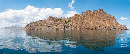 simsearch:400-05678506,k - The view on Karadag rock (reserve on place of ancient extinct volcano) from the side of a excursion ship (Crimea, Ukraine). Six shots stitch image. Stockbilder - Microstock & Abonnement, Bildnummer: 400-04080913