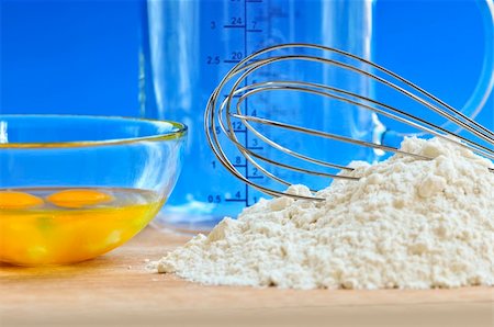 Flour, whisk and eggs in a bowl, baking ingredients Stock Photo - Budget Royalty-Free & Subscription, Code: 400-04080979