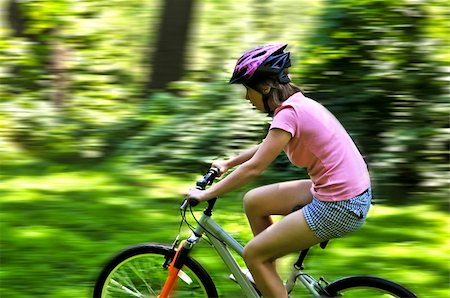 simsearch:400-04890875,k - Portrait of a teenage girl riding a bicycle in summer park outdoors Stock Photo - Budget Royalty-Free & Subscription, Code: 400-04080990