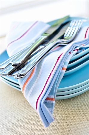 simsearch:400-05178995,k - Table setting with stack of plates and cutlery Stock Photo - Budget Royalty-Free & Subscription, Code: 400-04081048