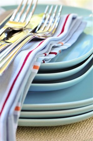 Table setting with stack of plates and cutlery Stock Photo - Budget Royalty-Free & Subscription, Code: 400-04081049