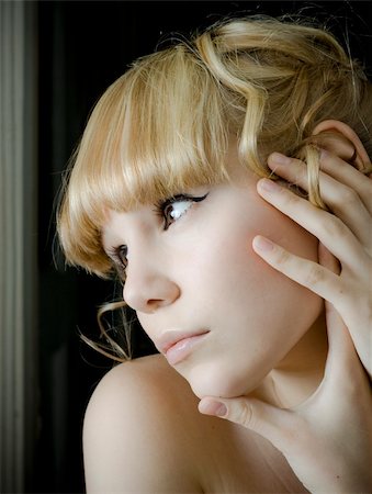 sad and quiet woman - Young woman gazing out a window photo Stock Photo - Budget Royalty-Free & Subscription, Code: 400-04081632