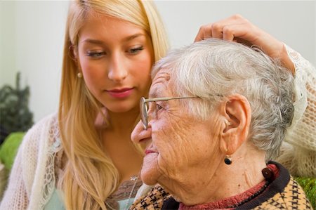 simsearch:400-04121486,k - A young woman pating an older one whit trust and empathy (focus on the old woman) - part of a series. Foto de stock - Super Valor sin royalties y Suscripción, Código: 400-04081829