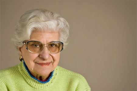 Senior lady portrait, smiling, with glasses, with copy space. Stock Photo - Budget Royalty-Free & Subscription, Code: 400-04082368