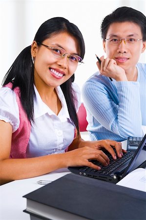 Two scholard in class is smiling to the camera Stock Photo - Budget Royalty-Free & Subscription, Code: 400-04082387